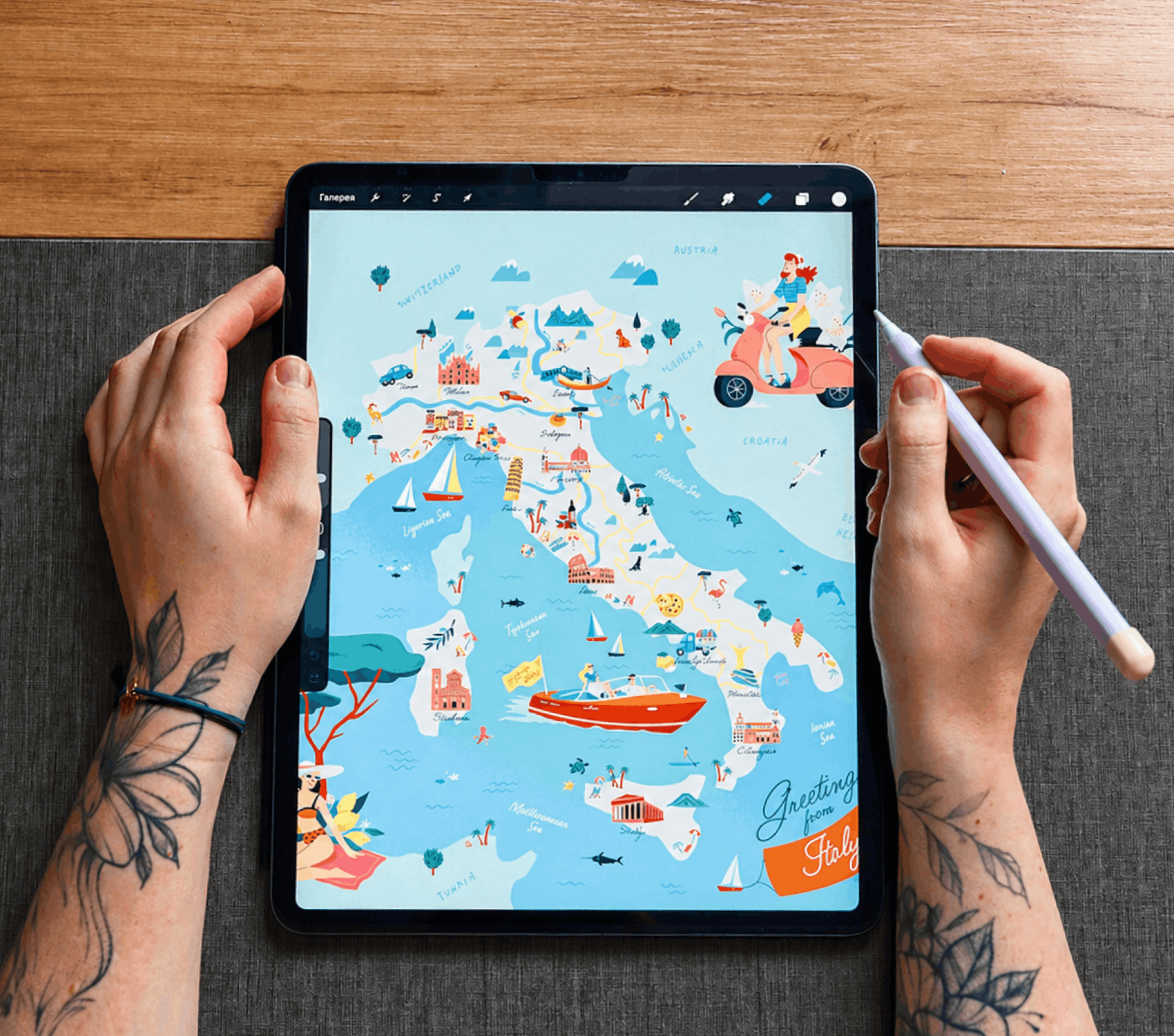 Photo of the iPad with an Italy map opened and hands around the device